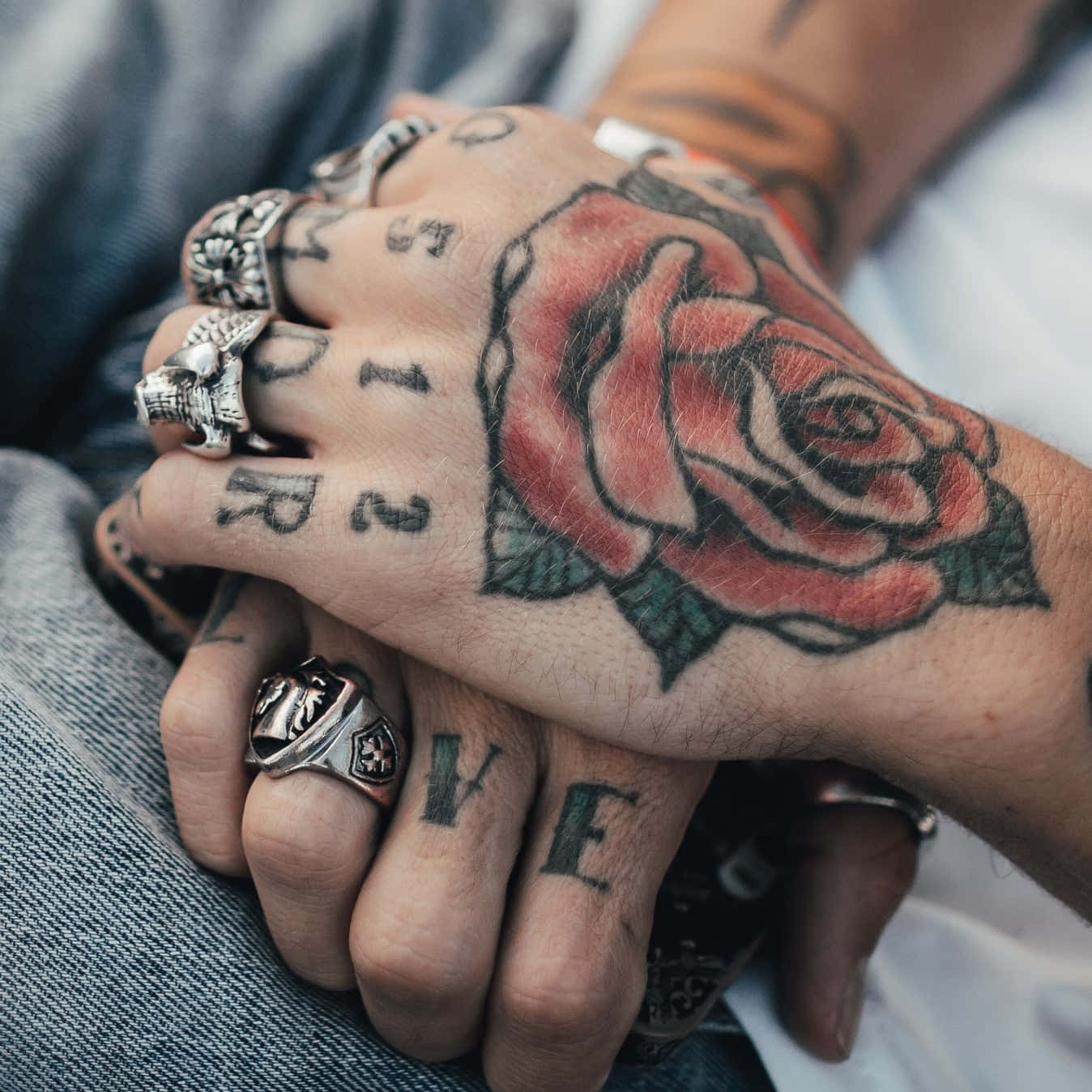 Captivating Red Rose Hand Tattoo Close Up Shot