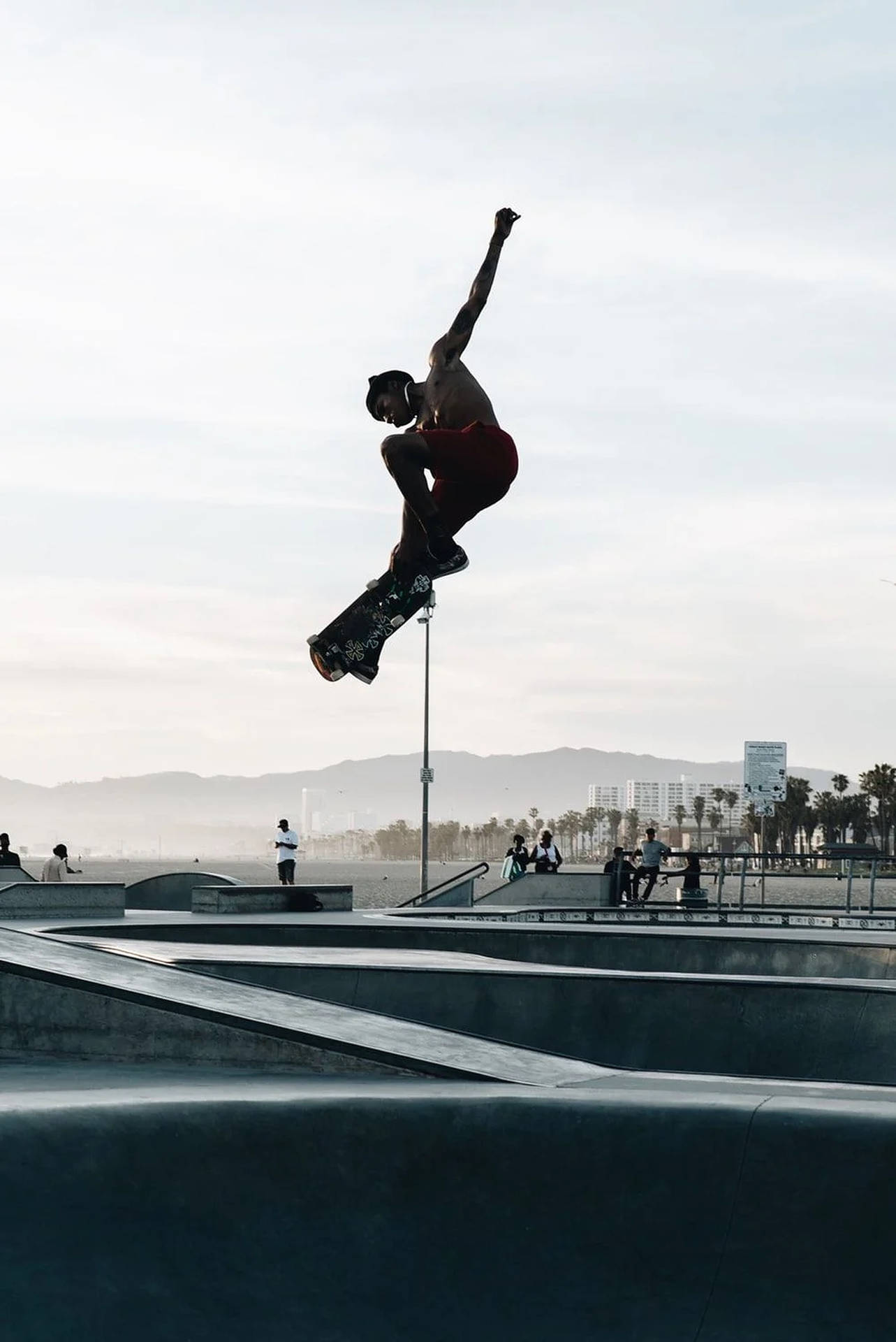 Captivating Skater Boy Performing Midair Trick Background
