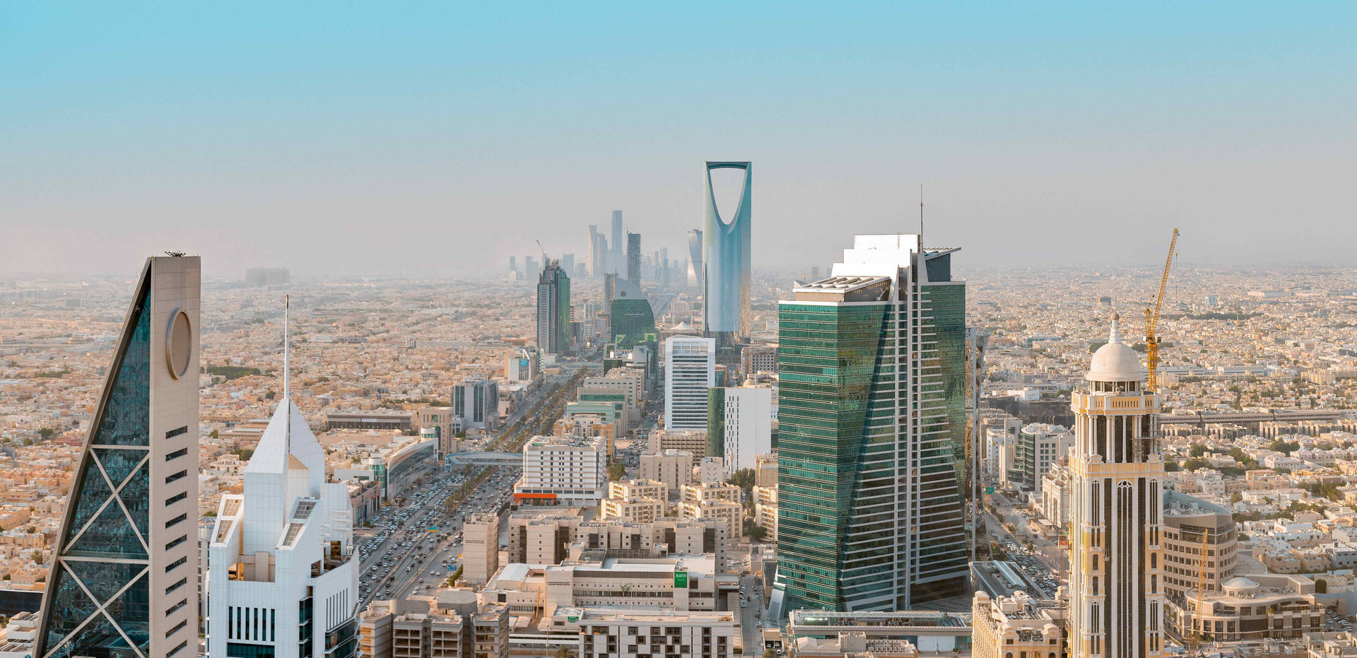 Captivating Skyscrapers Dominating Riyadh Skyline Background