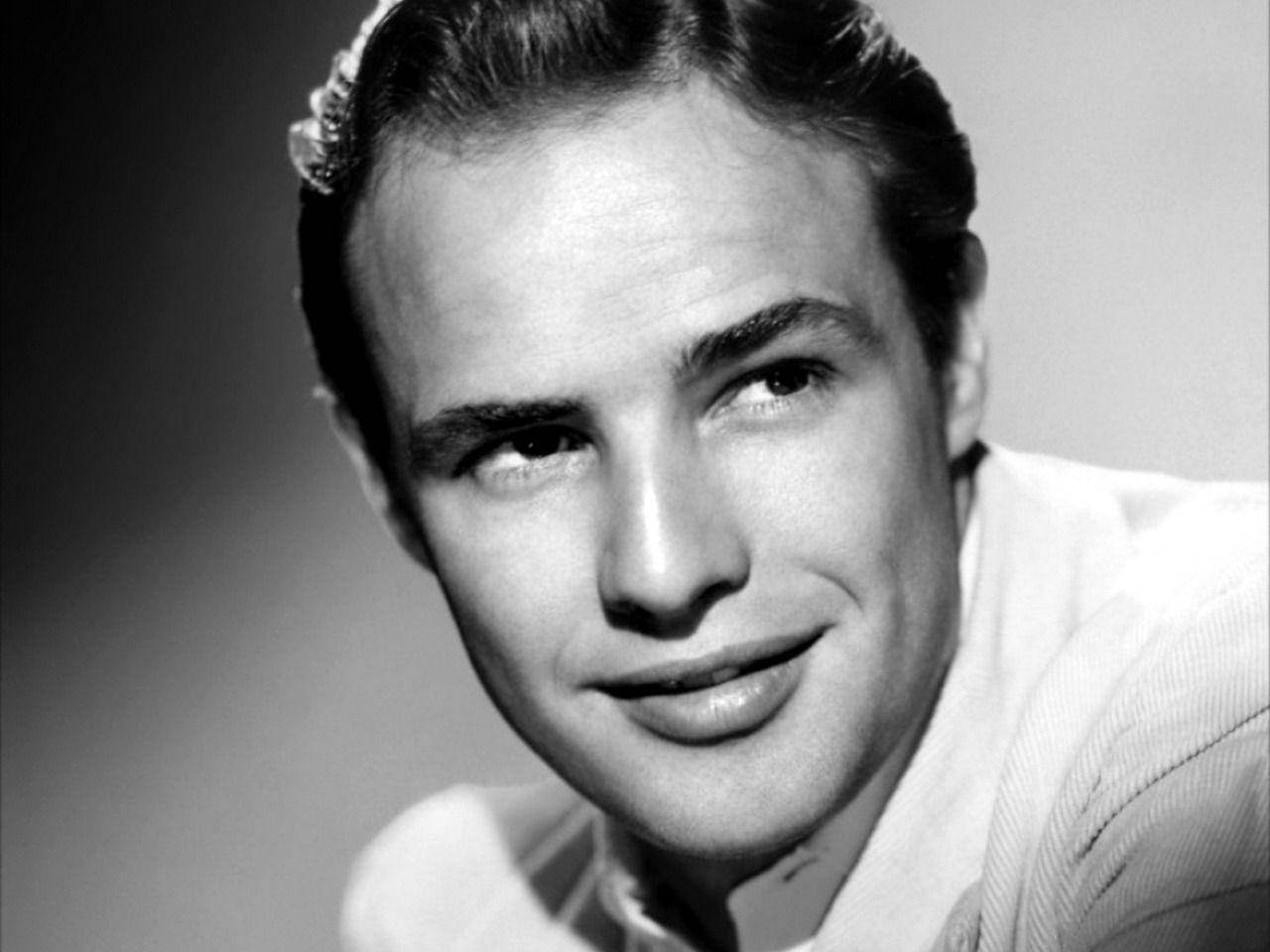 Captivating Smile Of Marlon Brando Background