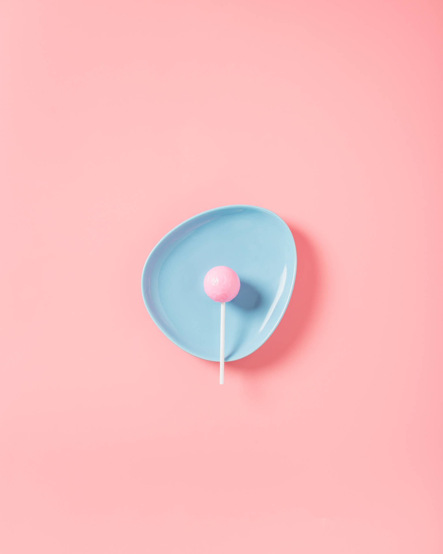 Captivating Solid Pastel Blue Lollipop Background