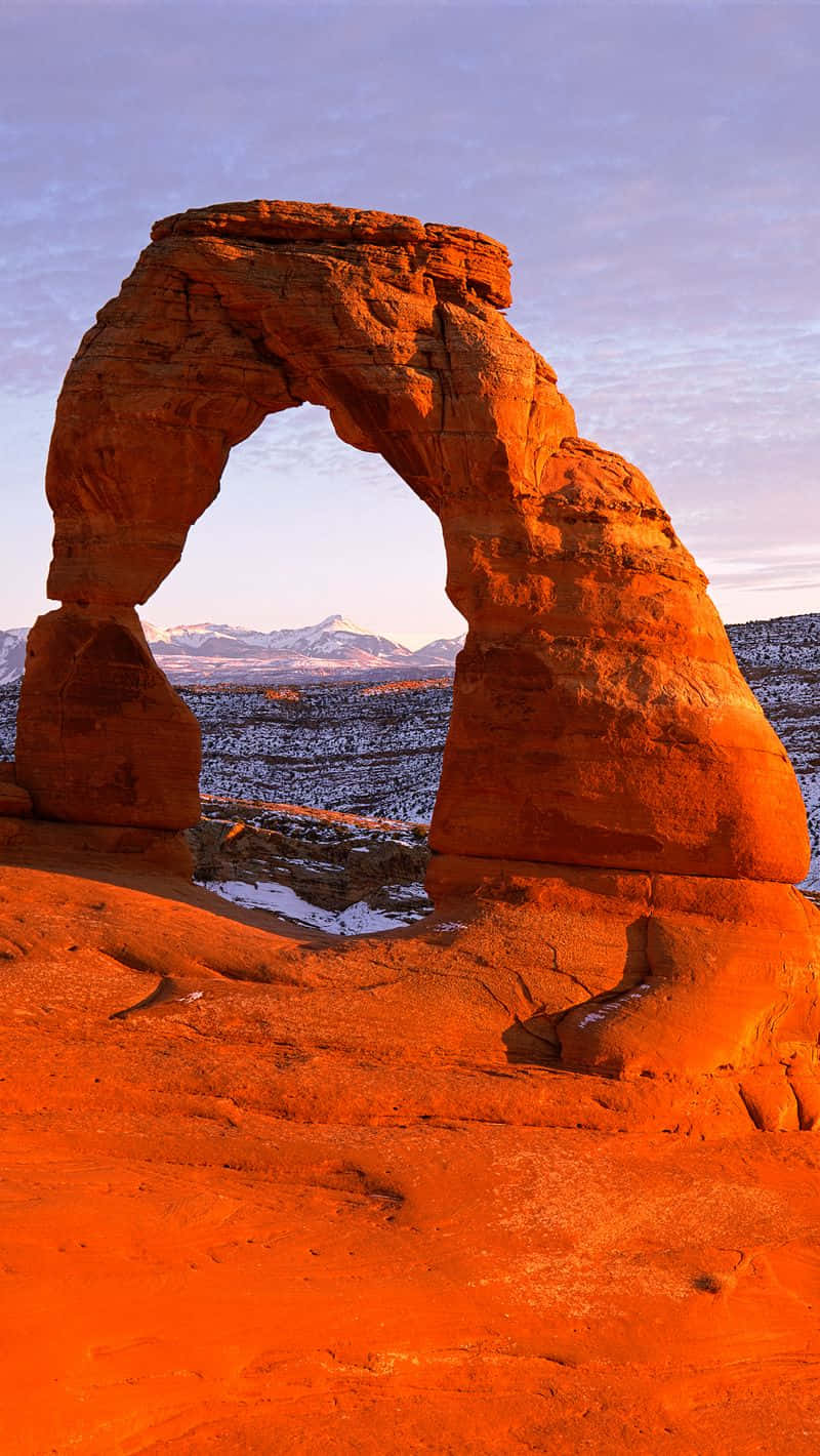 Captivating Sunset Over Delicate Arch In Utah Background