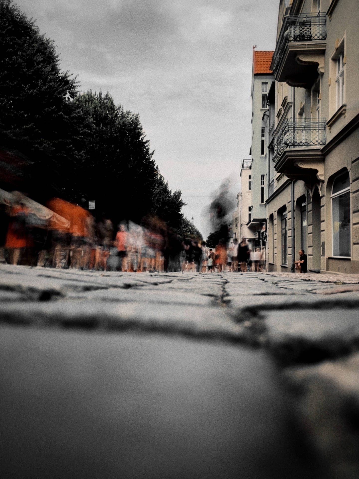 Captivating View Of A Crooked House On A Cobbled Street Background