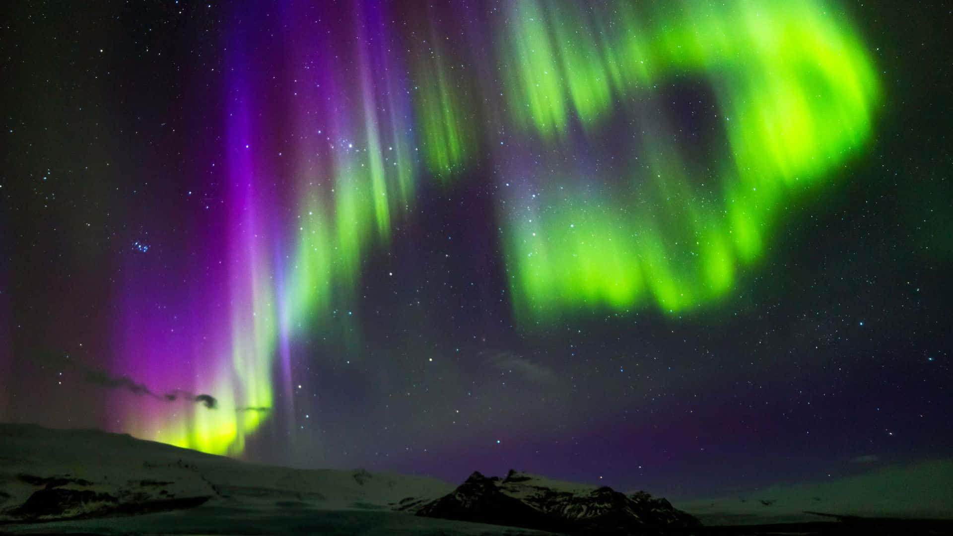 Captivating View Of Aurora Borealis In A Starry Night Sky