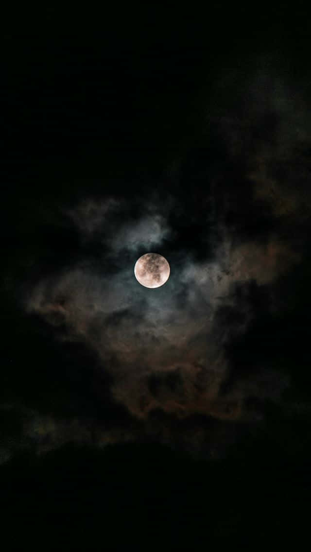 Capture A Piece Of The Night Sky With This Stunning Moon Iphone Wallpaper. Background