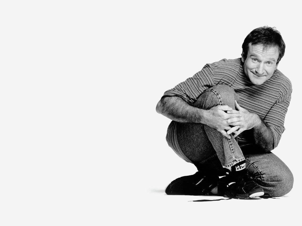 Captured Moments: Robin Williams In A Laid-back Pose. Background