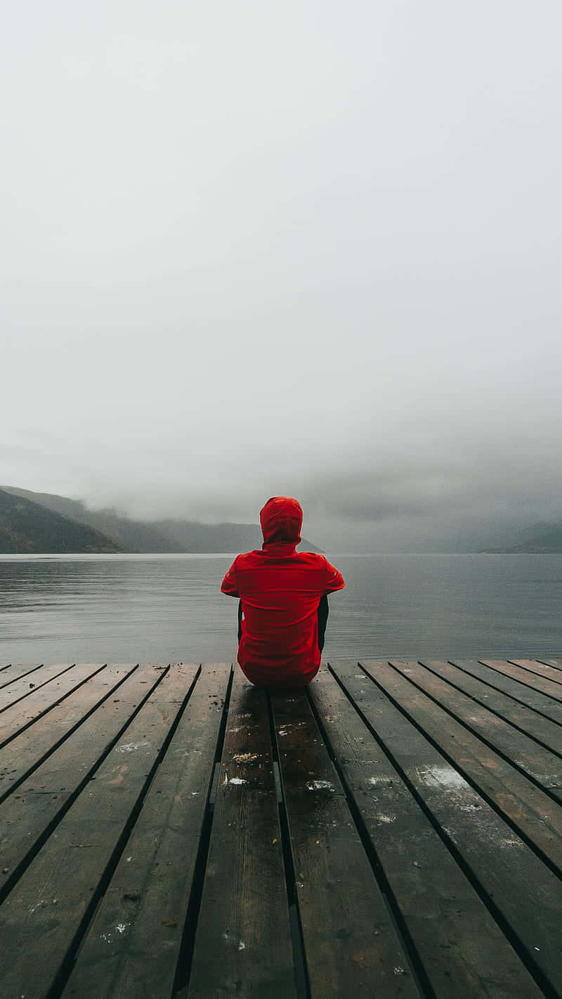 Capturing Emotion: Cool Sad Boy In Red Background