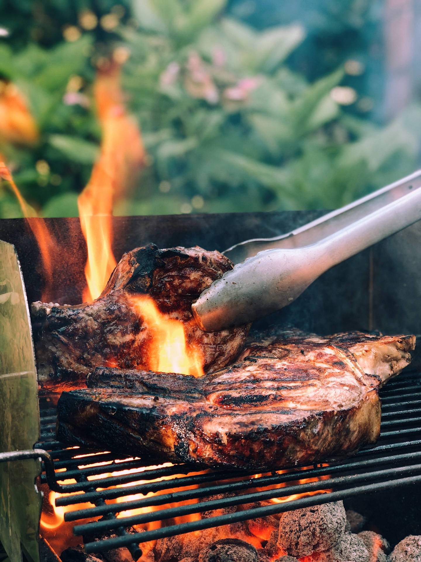 Capturing The Charm Of Authentic Steak Parrilla Grilling Outdoors Background