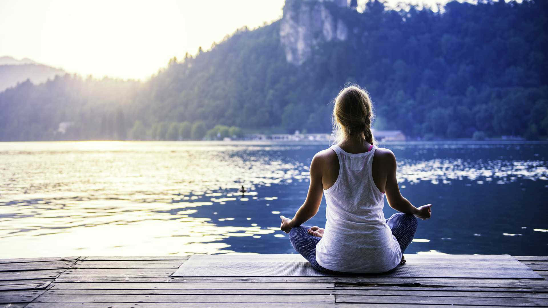 Capturing Zen: Woman Meditating In Lotus Position