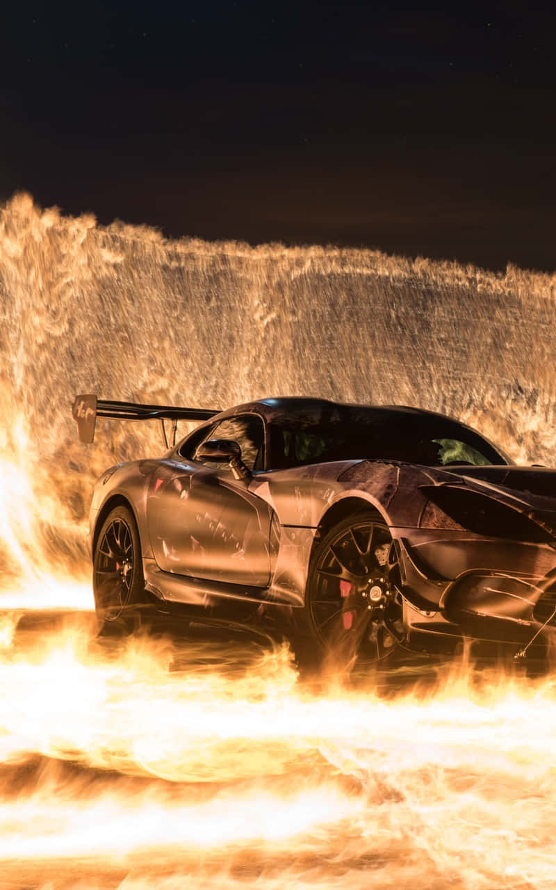 Car Zooming Through Android Fire Background