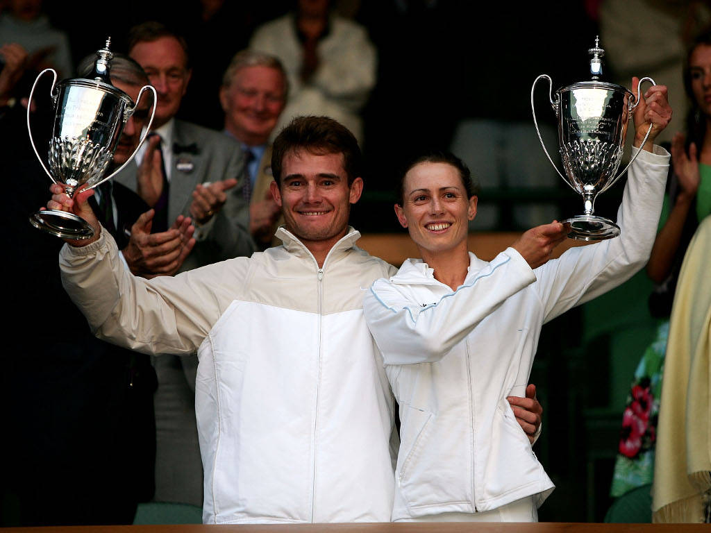 Cara Black And Wayne Black In Action On The Tennis Court Background