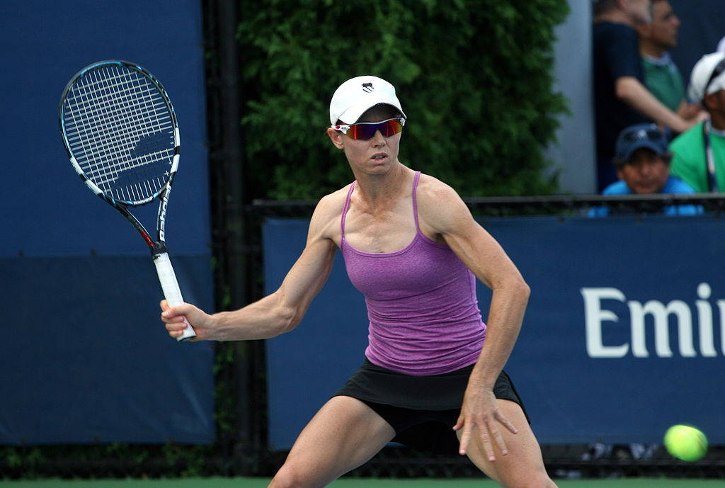 Cara Black In Action With Her Tennis Racket Background