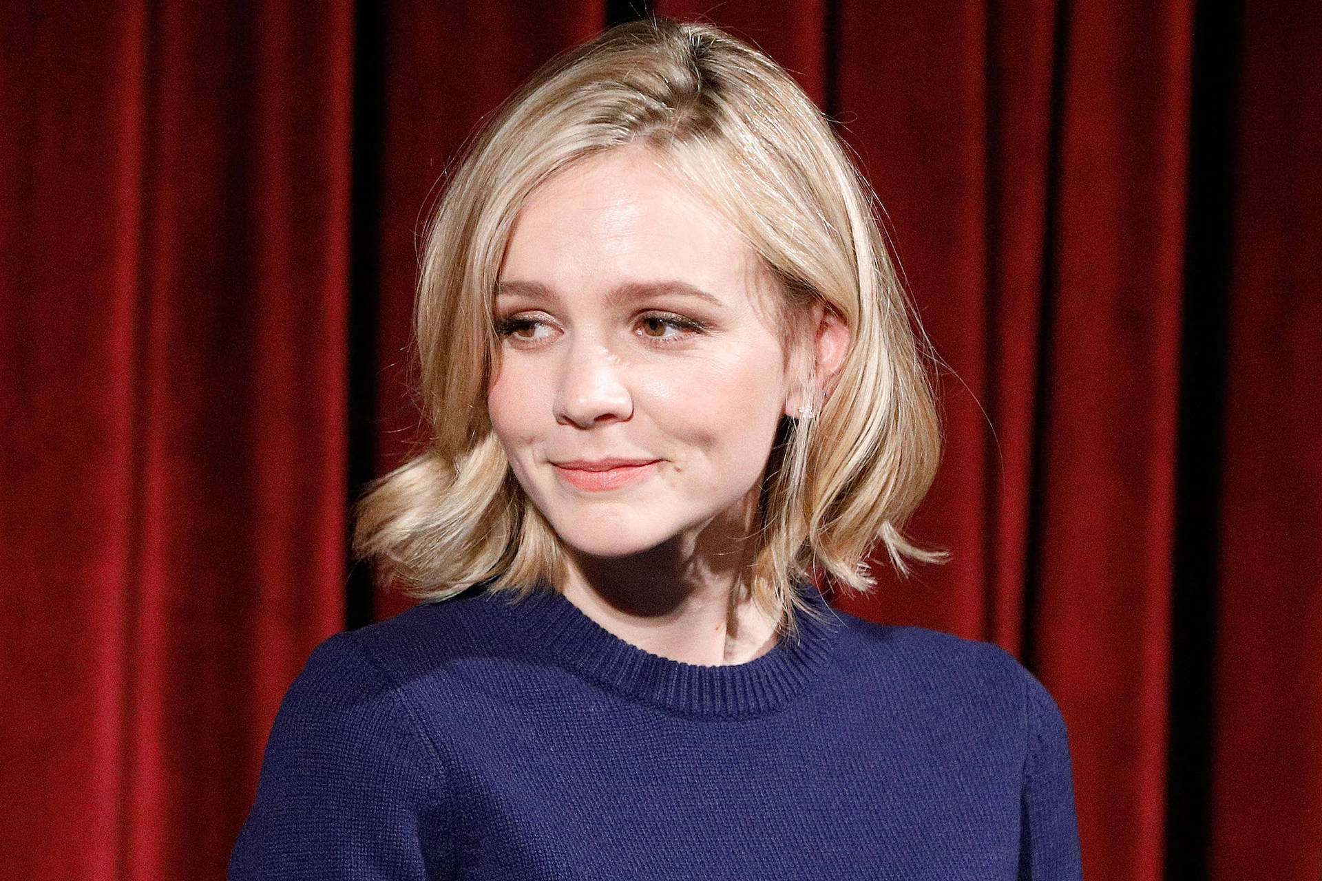 Carey Mulligan Showing Dimple Background