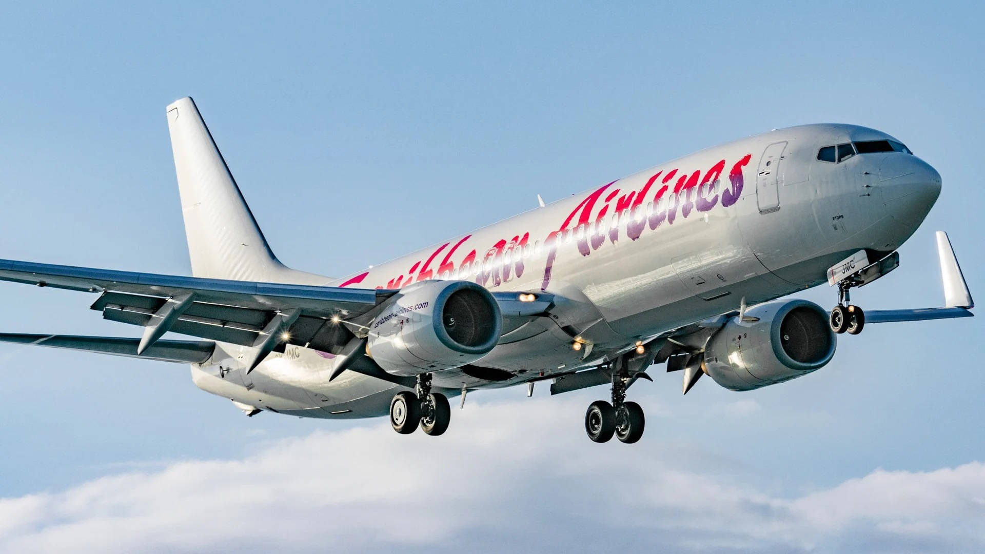 Caribbean Airlines Above The Clouds Background