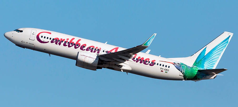 Caribbean Airlines Plane Elevating To The Sky Background