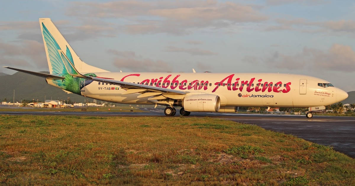 Caribbean Airlines Plane On Runway Grasslands