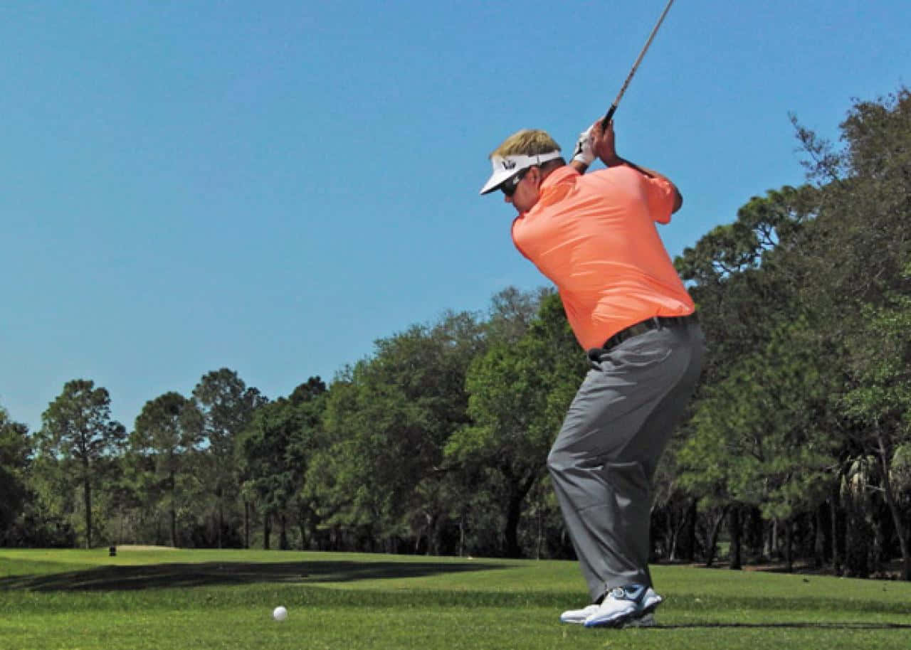 Carl Pettersson In Action During A Golf Tournament Background