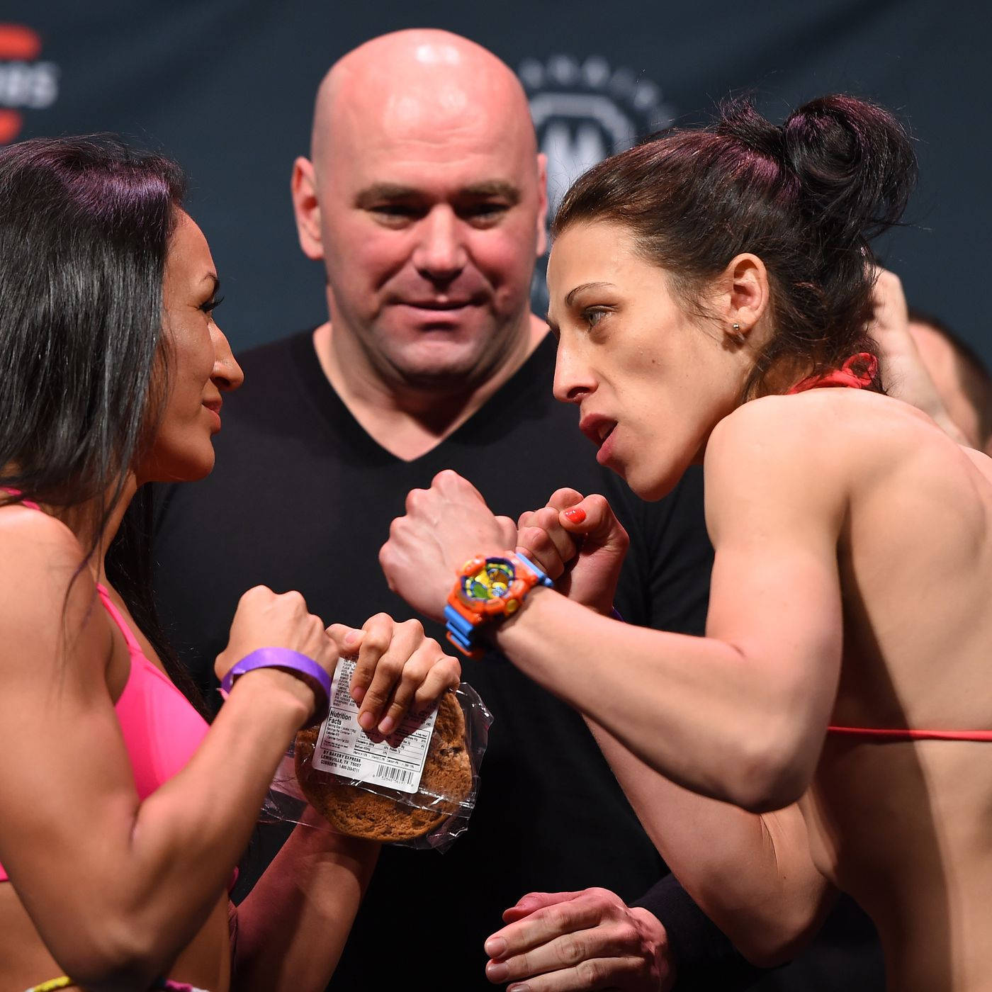 Carla Esparza And Mackenzie Dern Posing Background