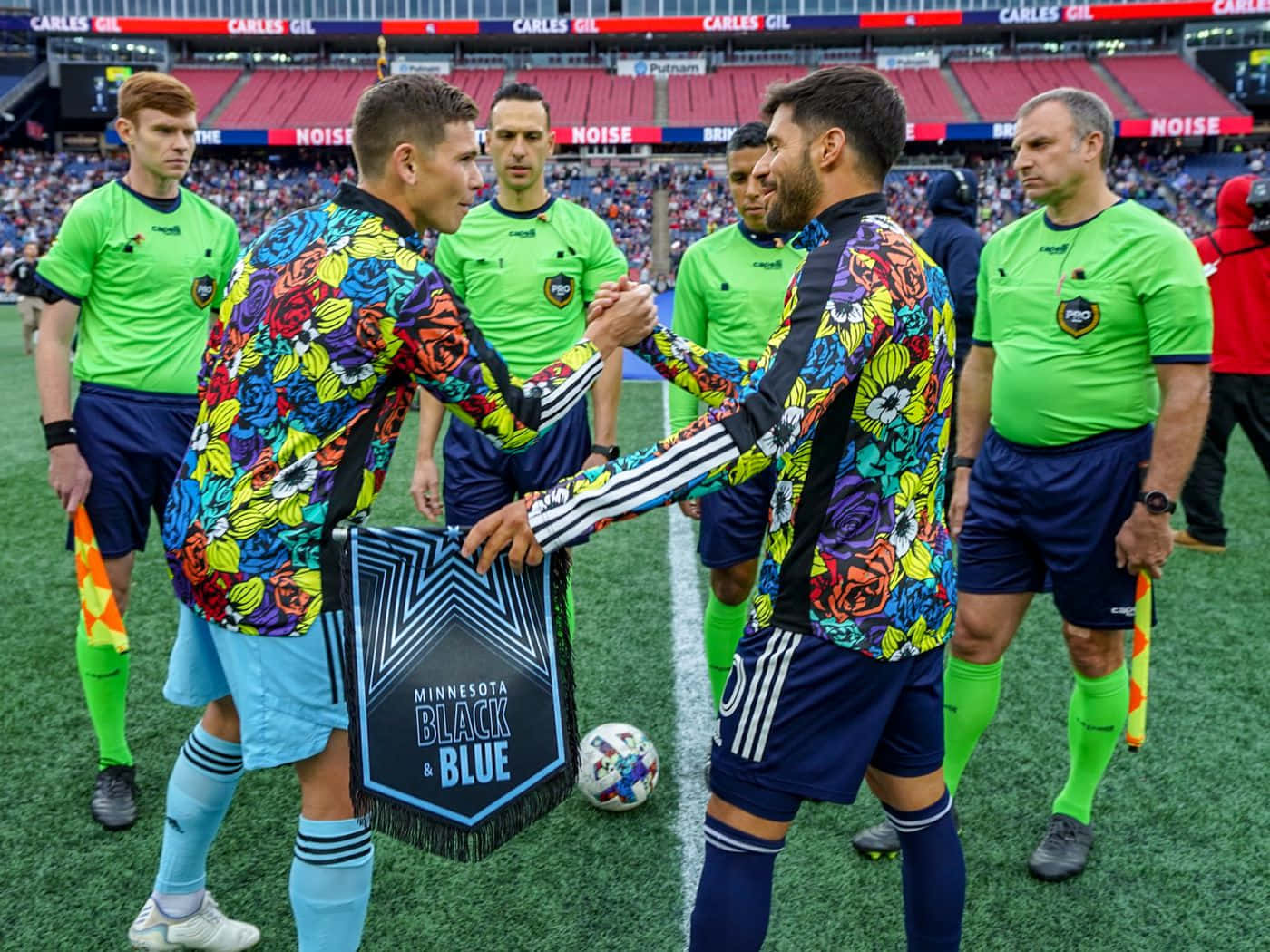 Carles Gil Handshaking With Minnesota Players Background