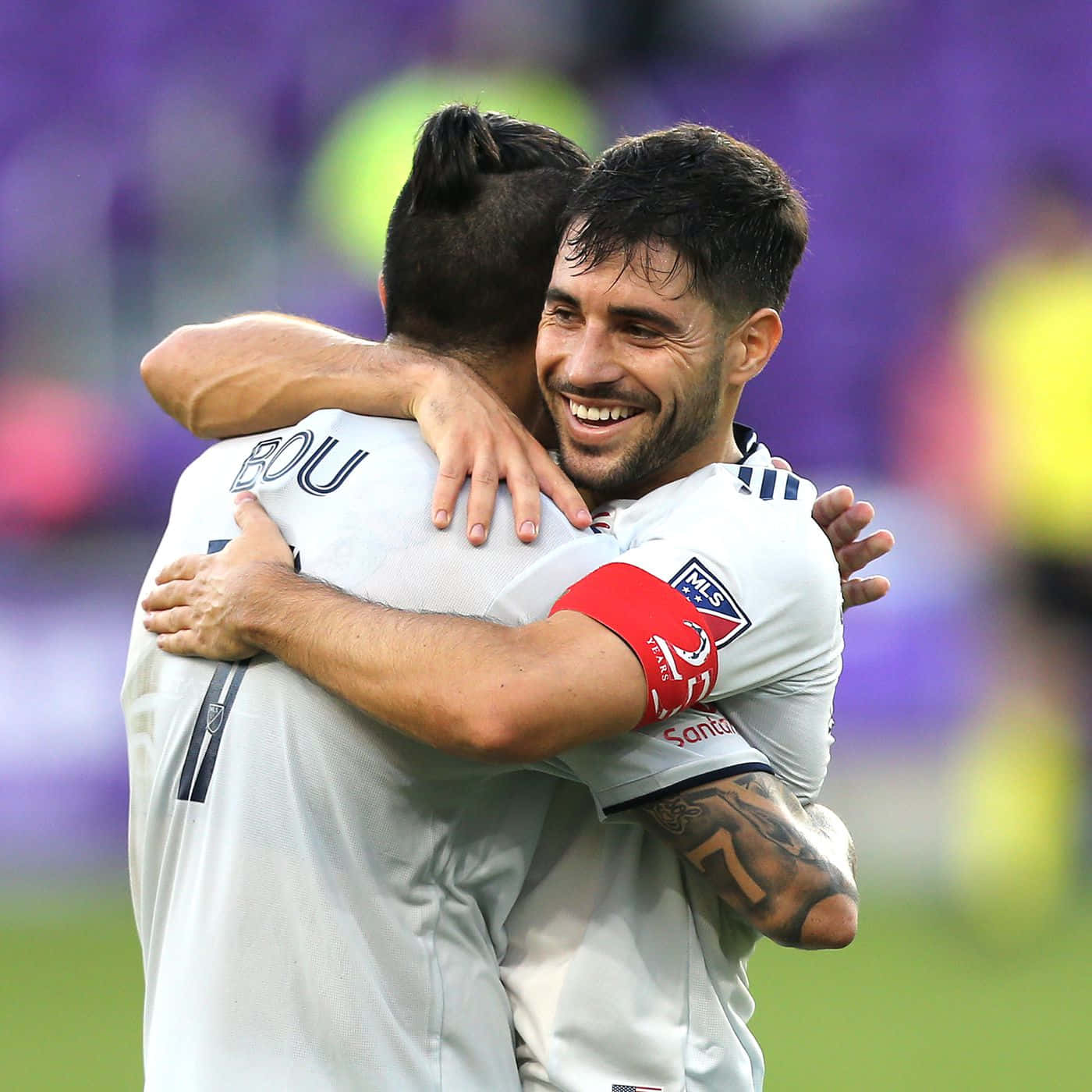 Carles Gil Hugging Gustavo Bou Background