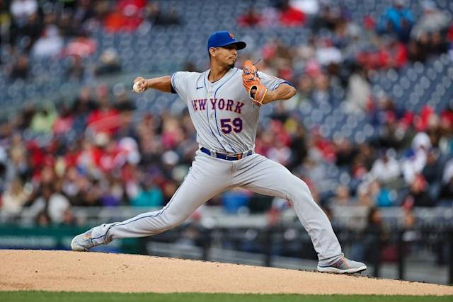 Carlos Carrasco Pitching The Ball Background