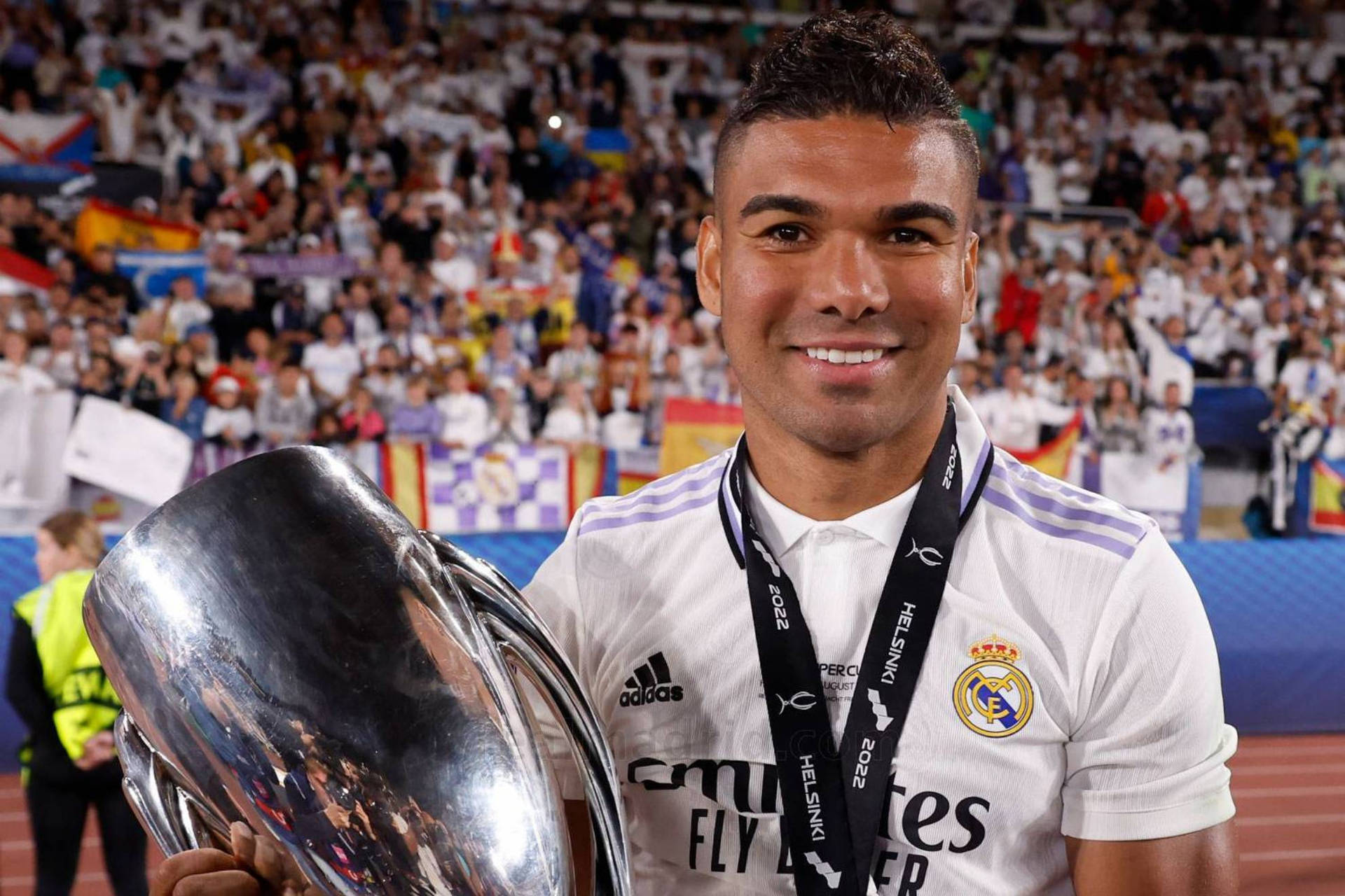 Carlos Casimiro Smiling With Trophy Background