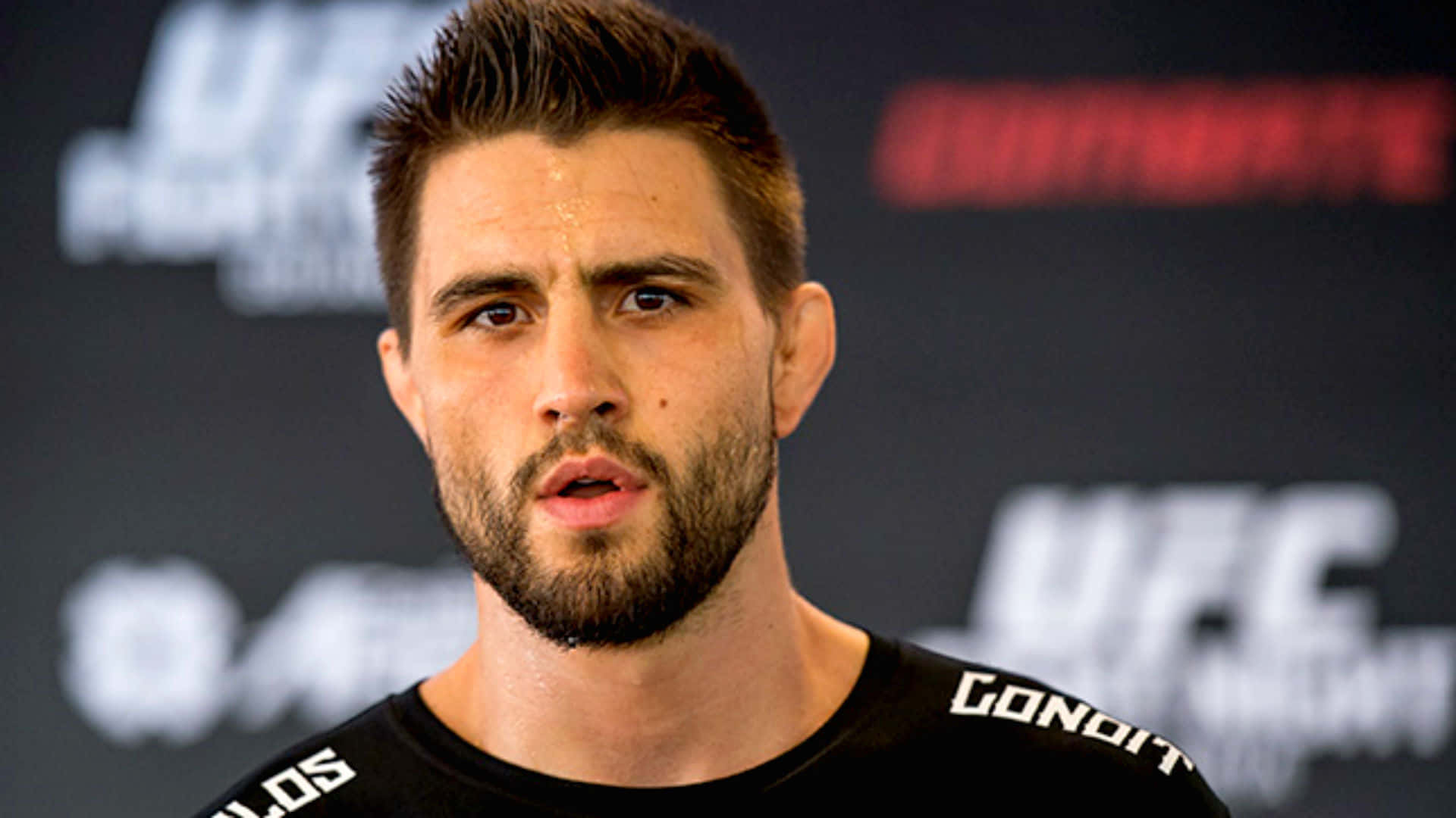 Carlos Condit Demonstrating His Exceptional Kickboxing Skills Background