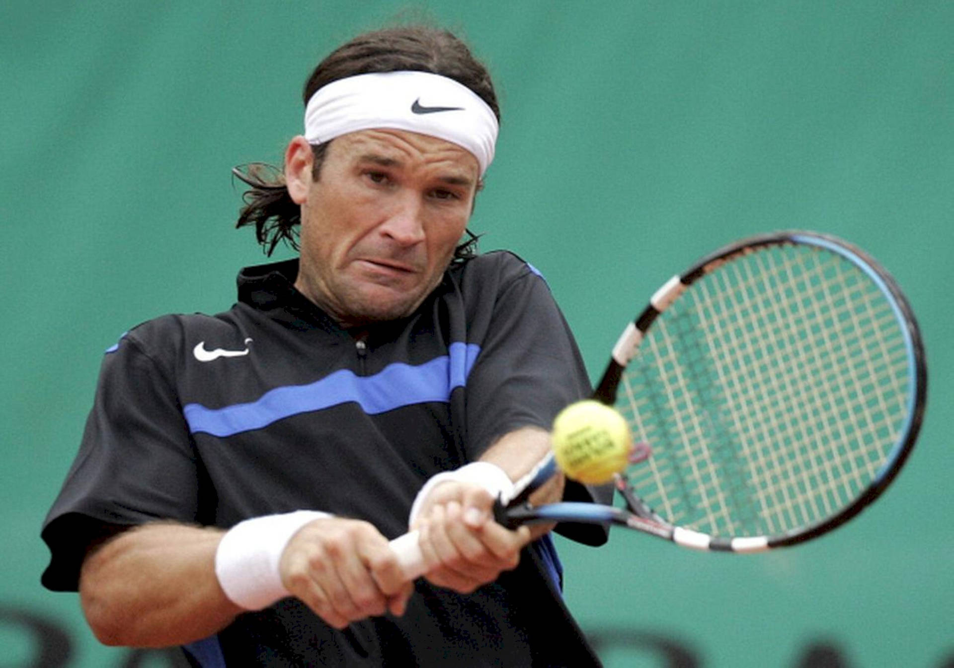 Carlos Moya Hitting Tennis Ball Background