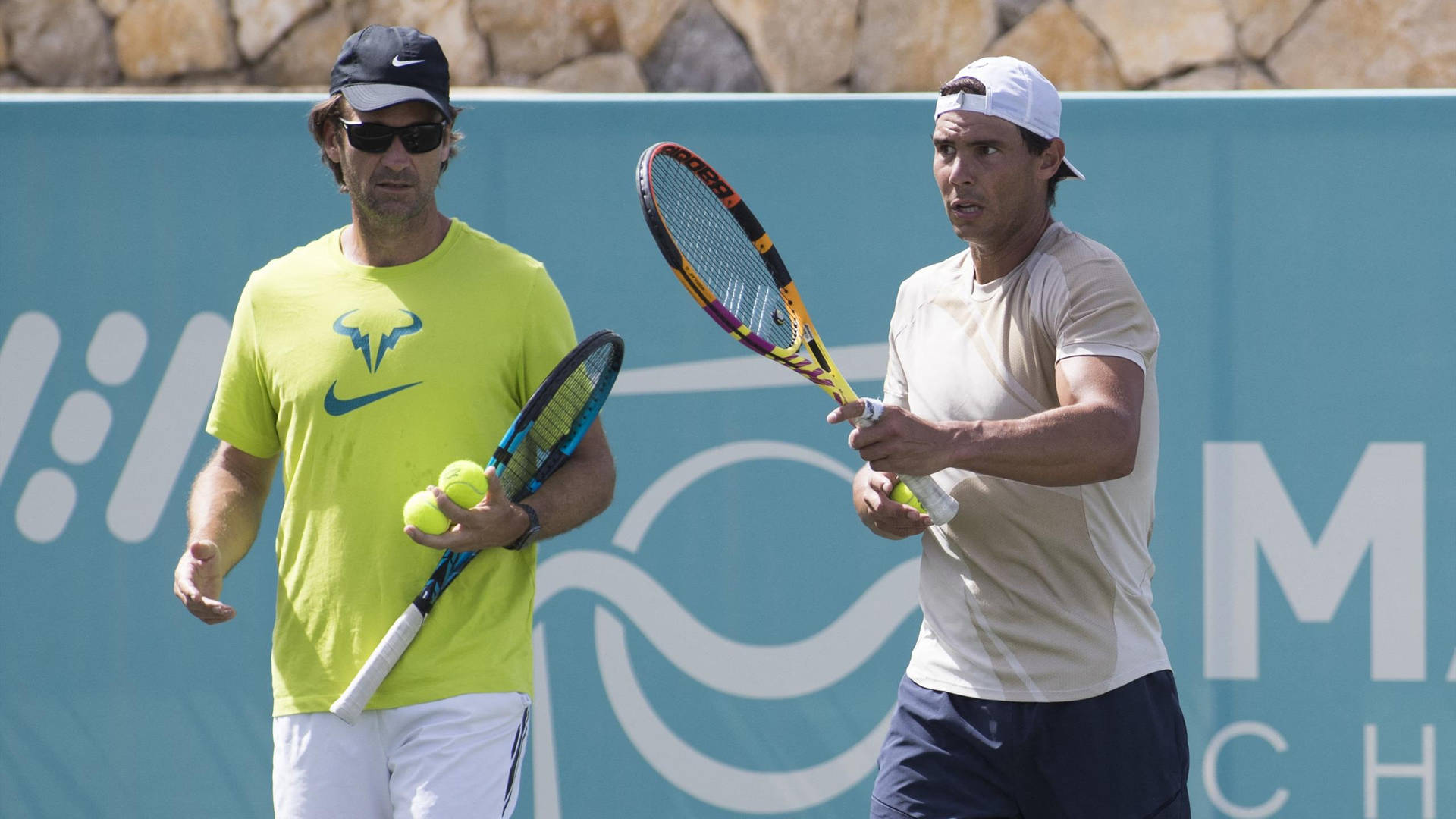 Carlos Moya Holding Racket And Balls Background