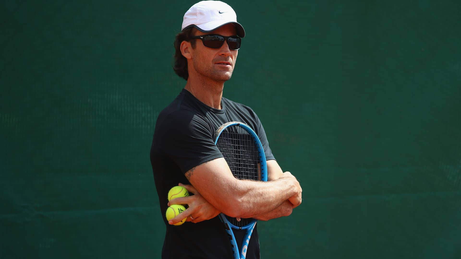 Carlos Moya Hugging Tennis Racket