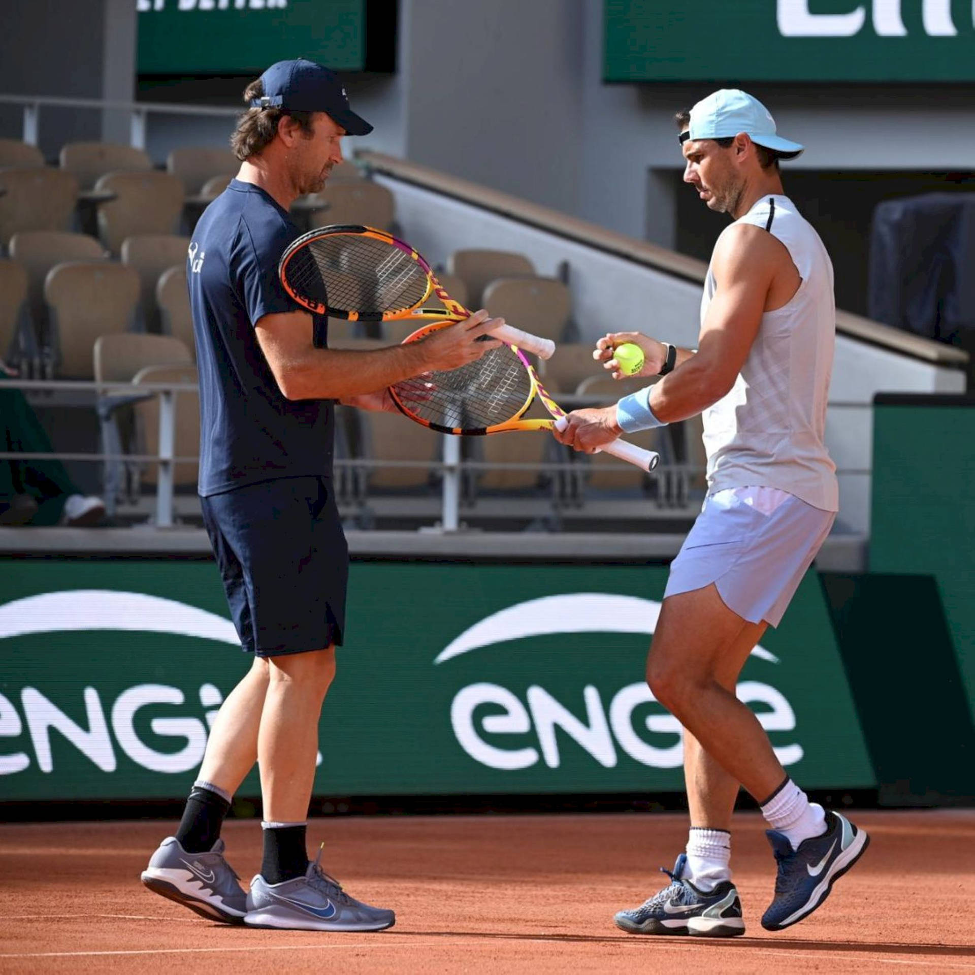 Carlos Moya Nadal Exchanging Rackets Background