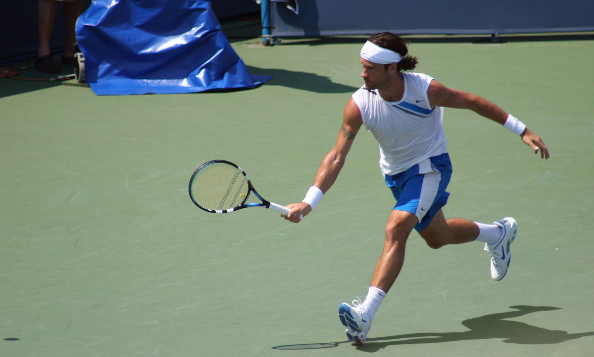 Carlos Moya Running With Racket Background