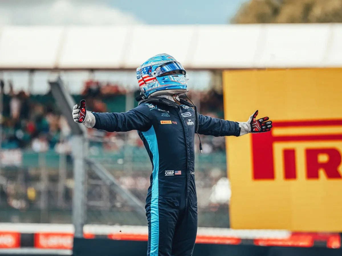 Carlos Sainz Jr. Embracing Victory With Open Arms. Background