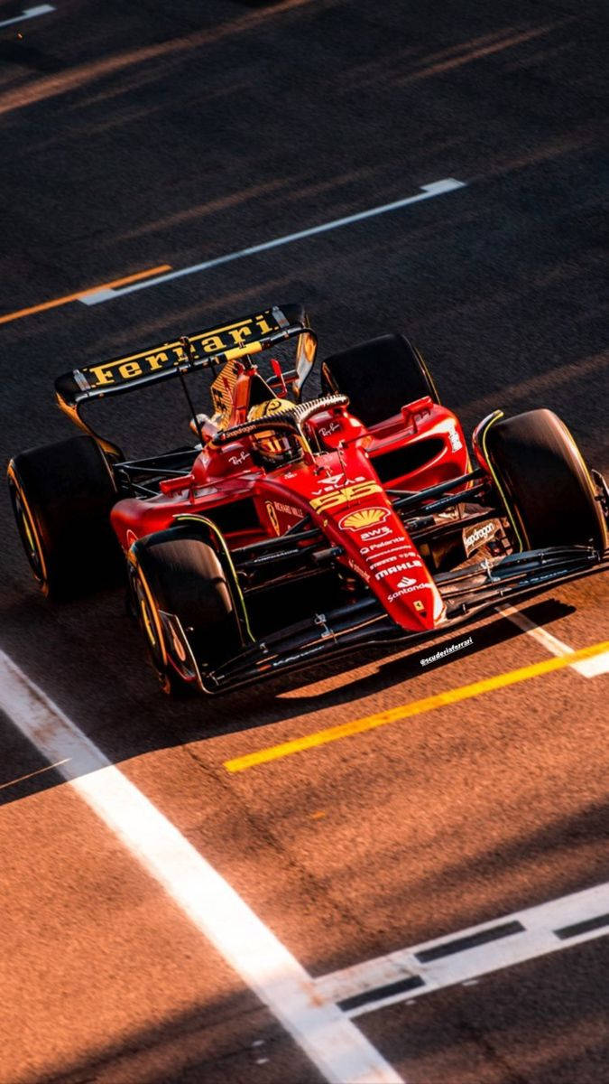 Carlos Sainz Jr. Fiercely Racing During The Golden Hour