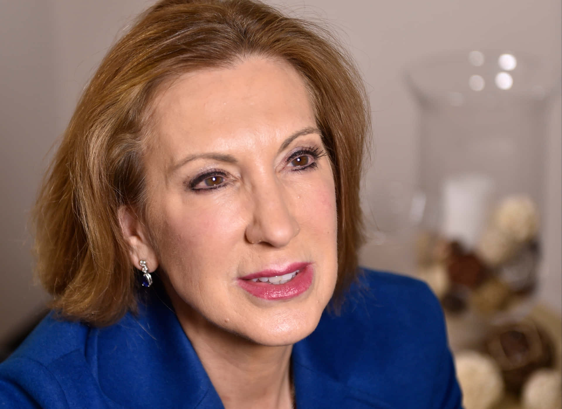 Carly Fiorina Speaking At Home Background