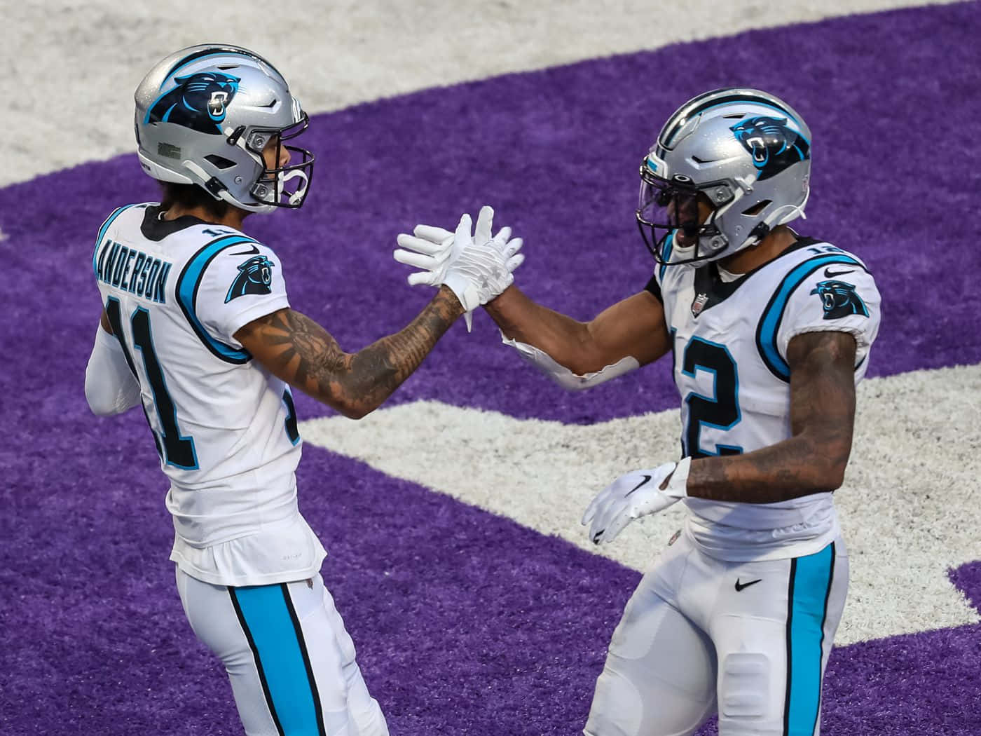 Carolina Panthers Athletes Dj Moore And Robby Anderson Background
