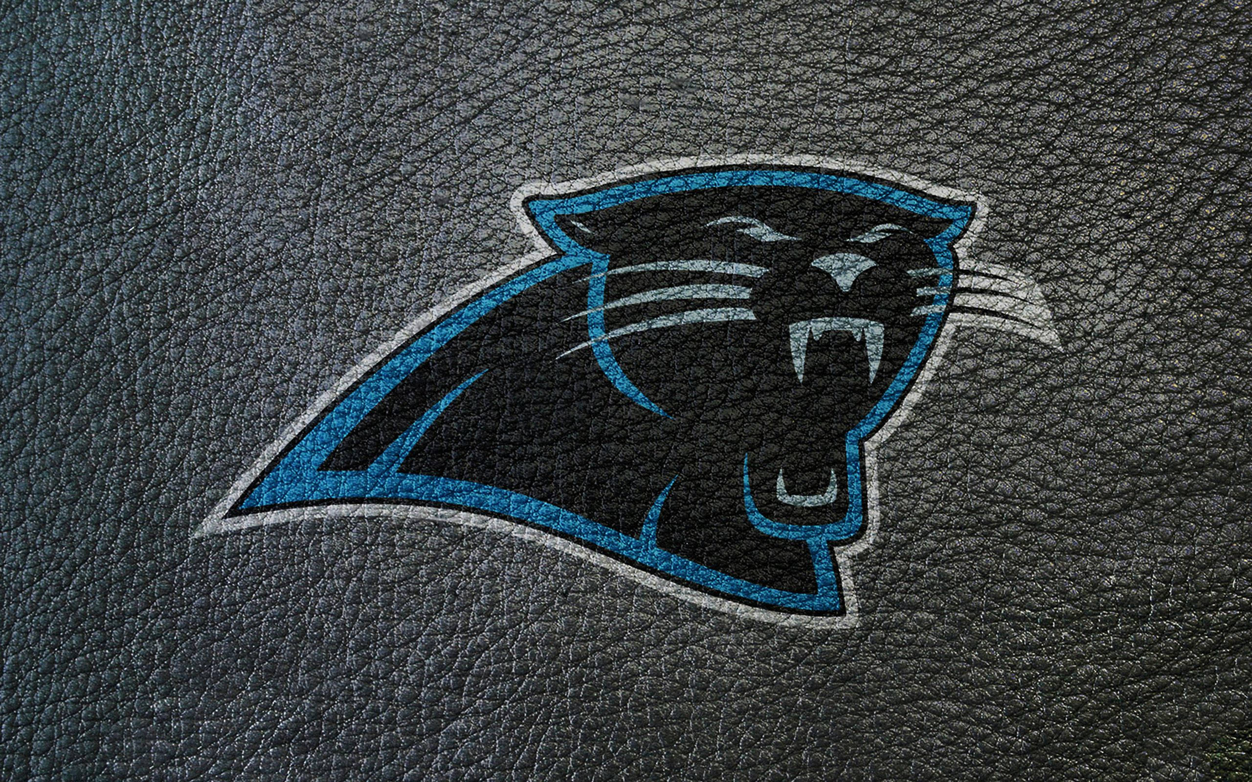 Carolina Panthers Logo On Leather Texture Background