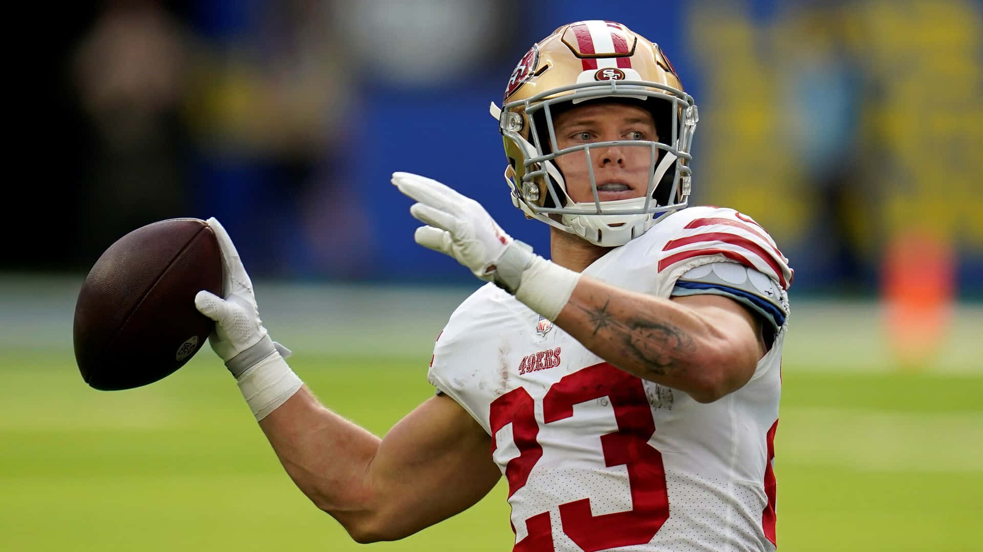 Carolina Panthers Rb Christian Mccaffrey On The Field Background