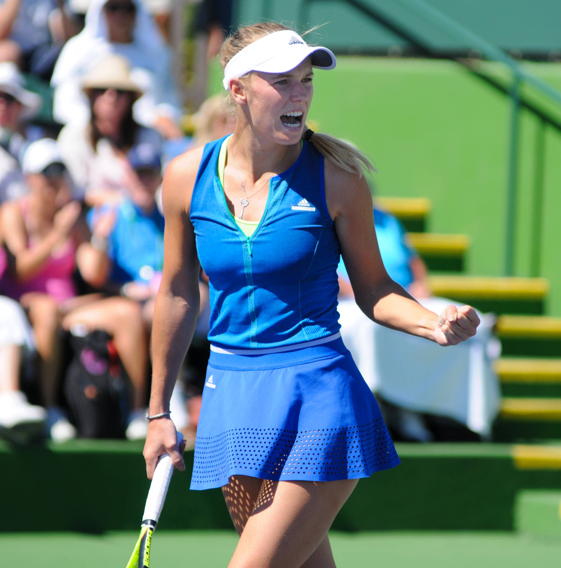 Caroline Wozniacki Wearing Blue Tennis Outfit Background