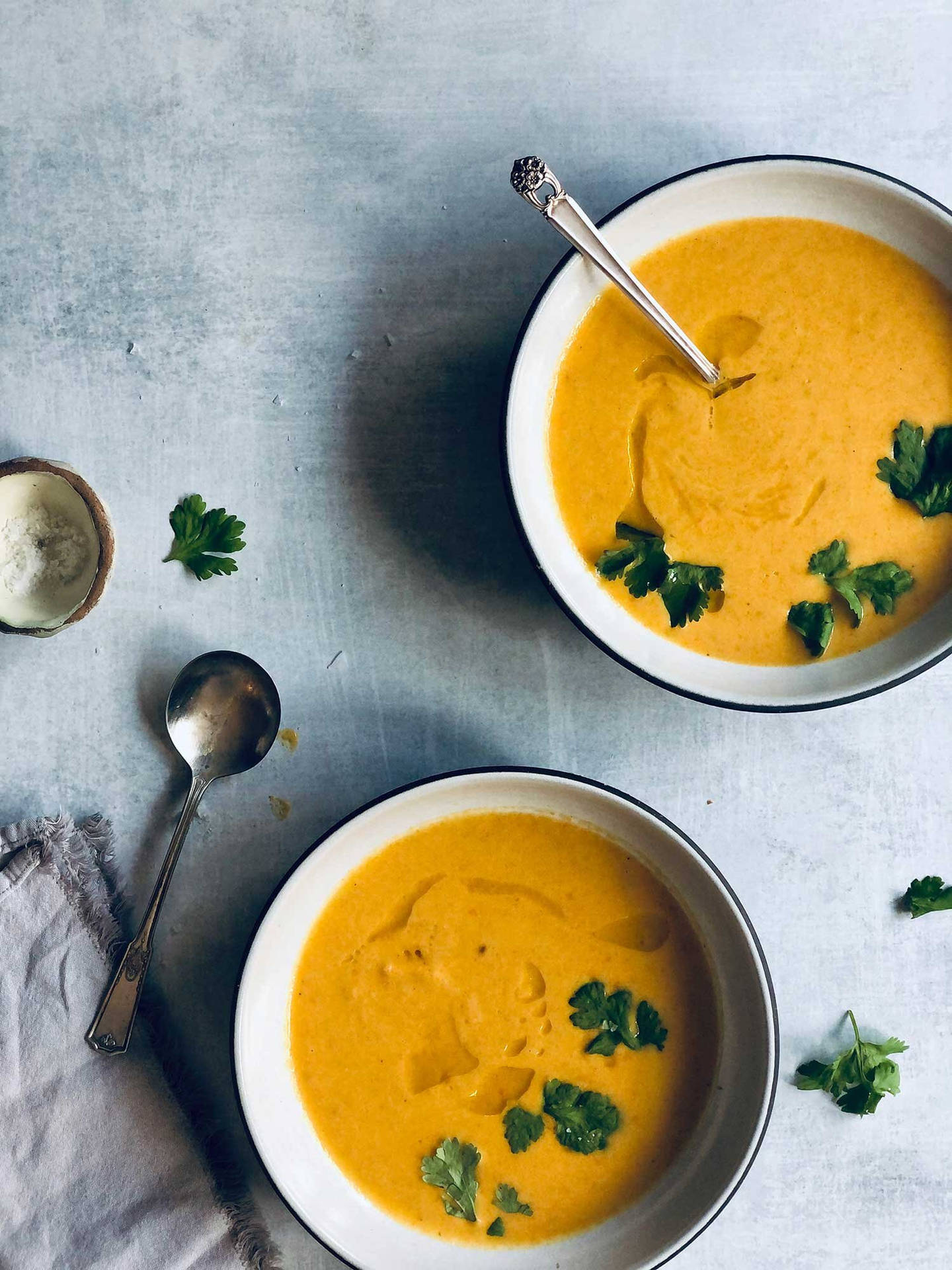 Carrot Soup With Green Leafy Garnish Background