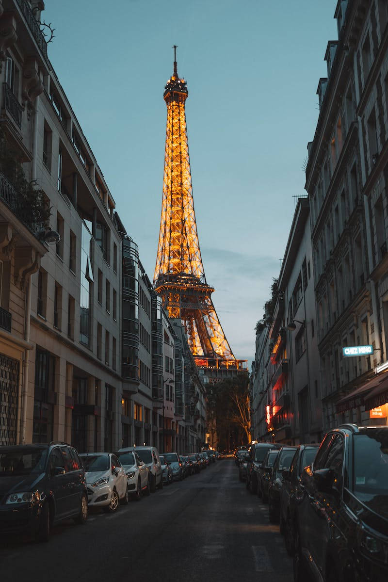 Cars And Eiffel Tower Night City Background