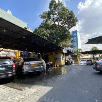 Cars Parking In A Car Wash Background