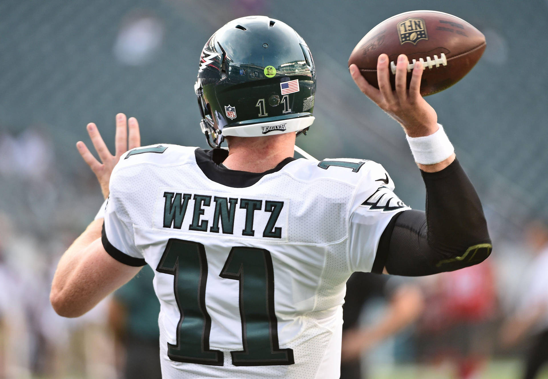 Carson Wentz Tossing Ball Nfl Background