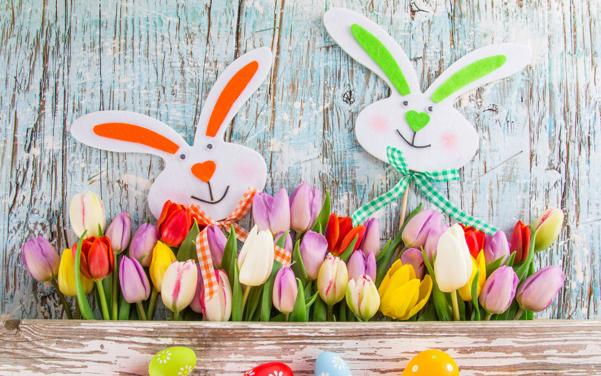 Cartoon Bunnies Happy Easter With Tulips Background