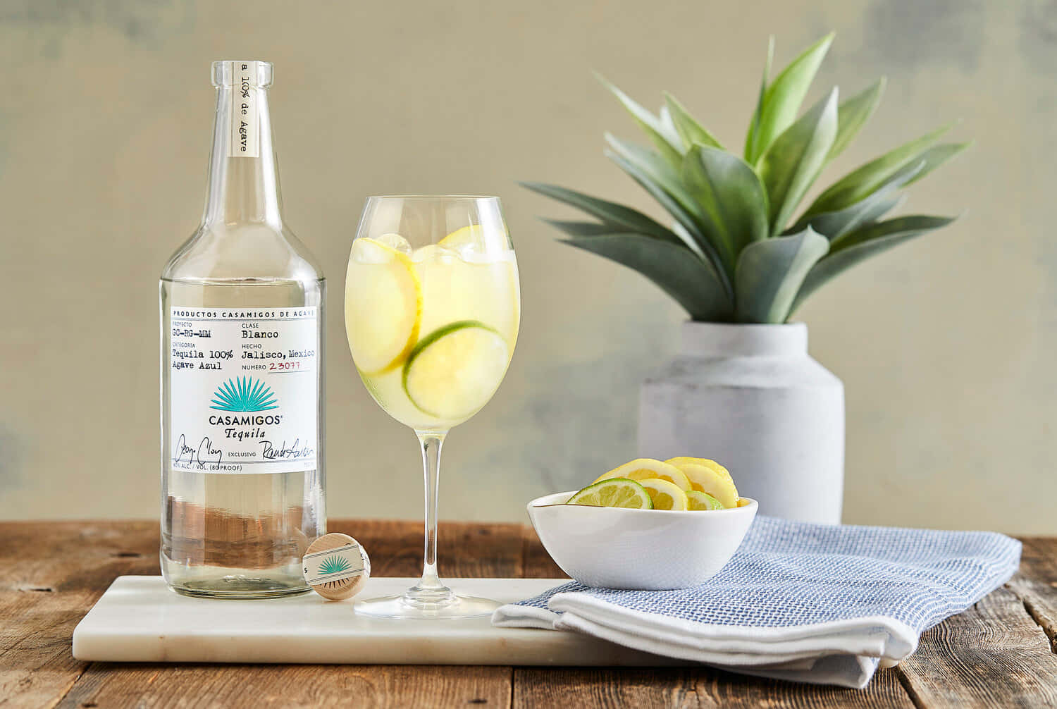 Casamigos Tequila Blanco Liquor With Lemon Lime Spritzer Background