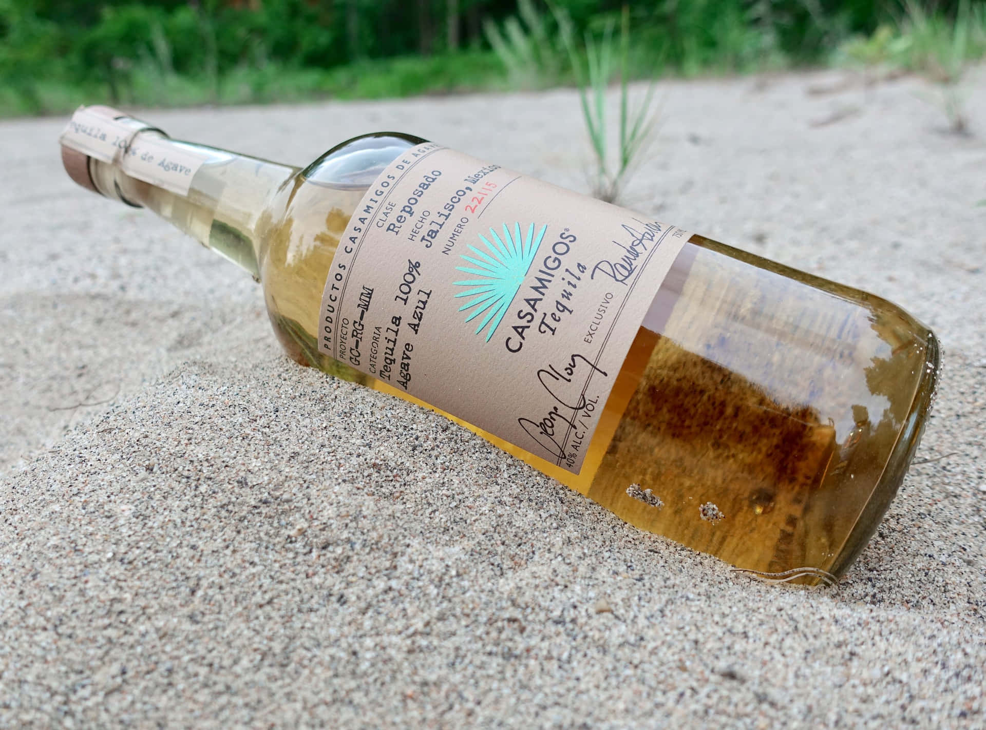 Casamigos Tequila Reposado Liquor Bottle On Sand Background