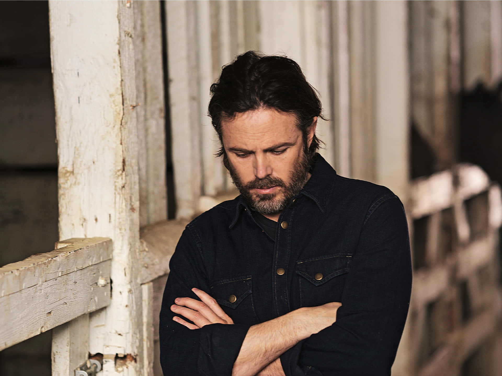 Casey Affleck Engrossed In Thought Background