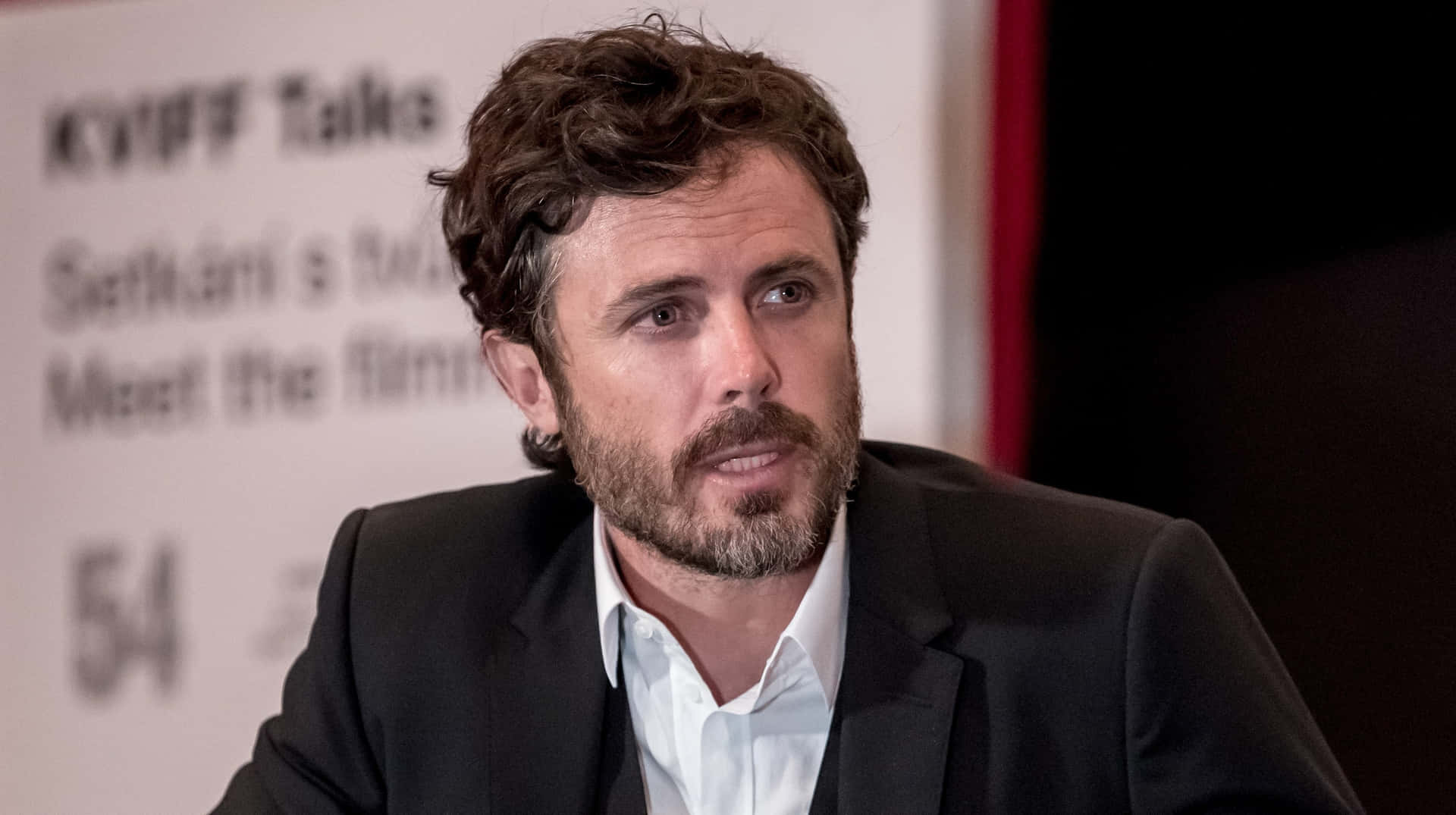 Casey Affleck Expressive Portrait Background