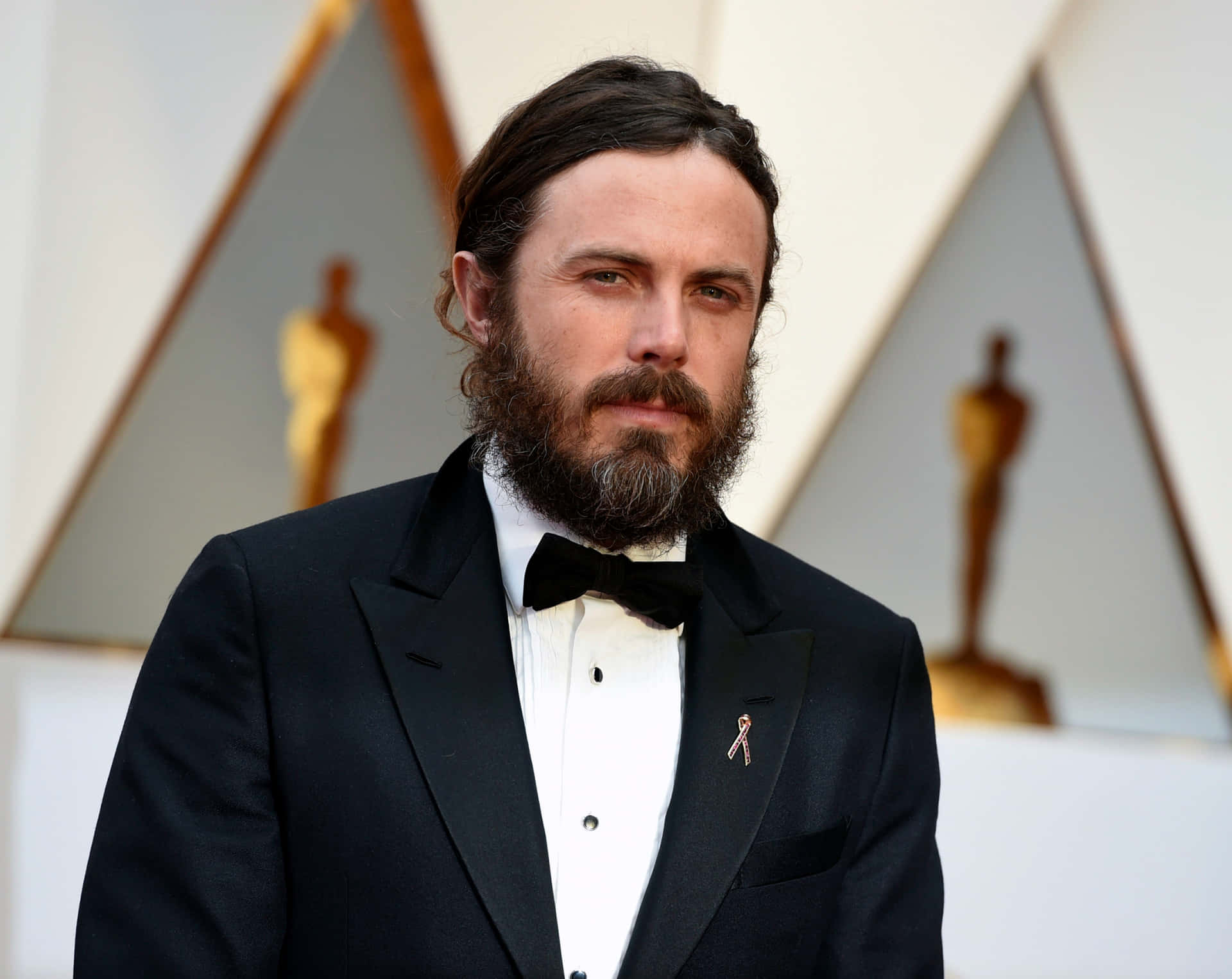 Casey Affleck In An Intense Pose Background