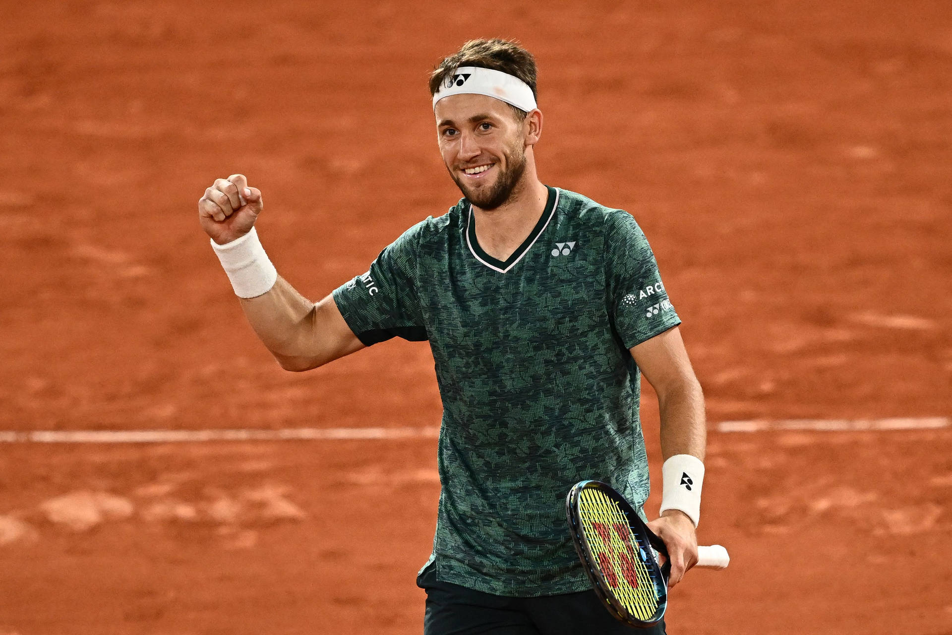 Casper Ruud Celebrates Victory With Fist Pump Background